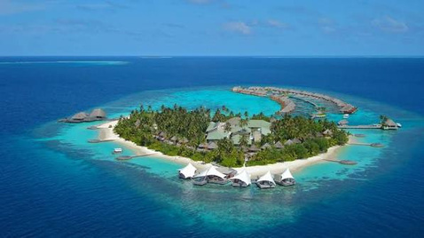 Maldives resort island surrounded by a turquoise lagoon