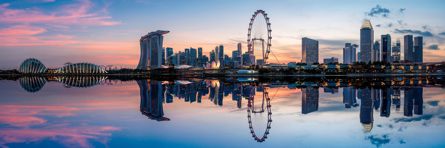 Singapore skyline reflected across Marina Bay